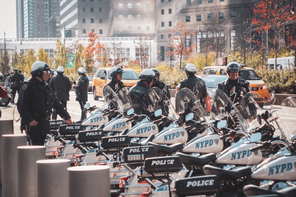 NYPD officers standing near NYPD service motorcycles